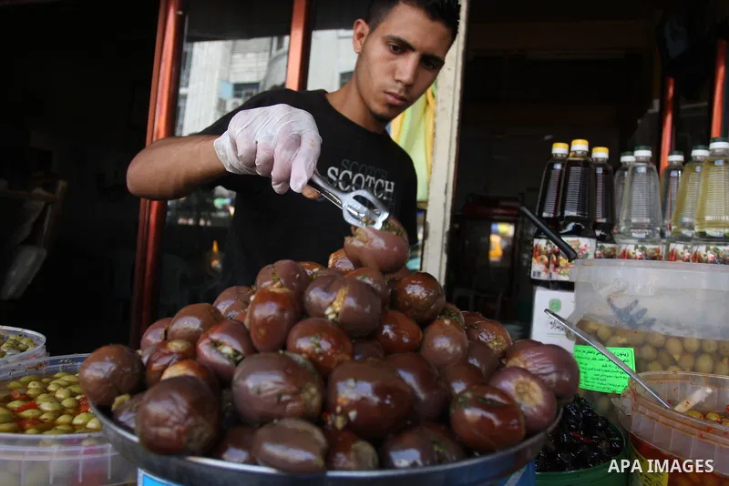 A Palestinian vendor sells pickles during the fasting month of Ramadan in the West Bank city of Ramallah, on July 23, 2012. Muslims around the world abstain from eating, drinking and conducting sexual relations from dawn...