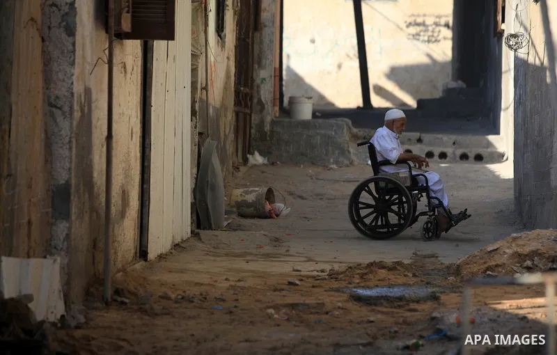A Palestinian man sits in front of his home in the Beach refugee camp in Gaza City before Breaking fast on the third day of the Holy month of Ramadan, in Gaza Strip, 24 July 2012. Muslims throughout the world are celebra...