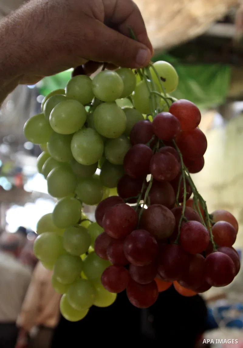 Palestinians shop at the traditional market in the West Bank city of Nablus, on the five day of the holy month of Ramadan ,on 24 July 2012. Muslims around the world abstain from eating, drinking and conducting sexual rel...