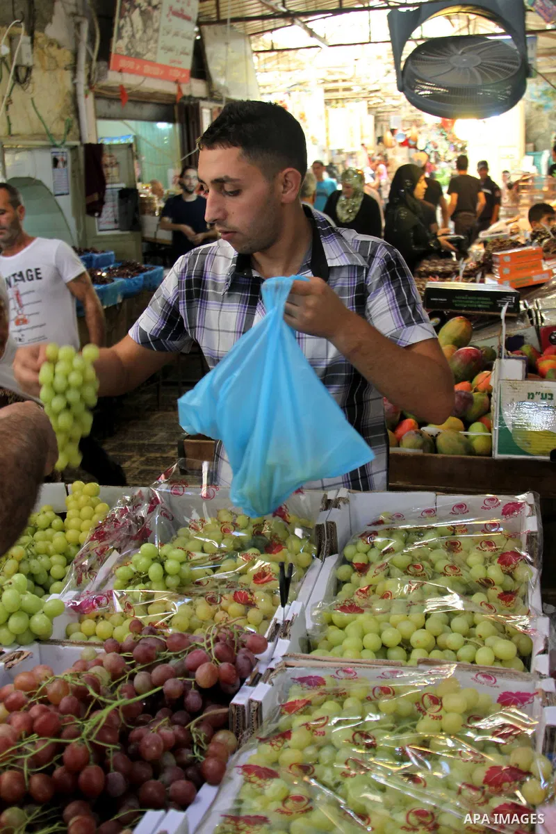 Palestinians shop at the traditional market in the West Bank city of Nablus, on the five day of the holy month of Ramadan ,on 24 July 2012. Muslims around the world abstain from eating, drinking and conducting sexual rel...