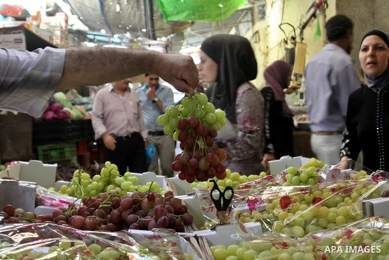 Palestinians shop at the traditional market in the West Bank city of Nablus, on the five day of the holy month of Ramadan ,on 24 July 2012. Muslims around the world abstain from eating, drinking and conducting sexual rel...