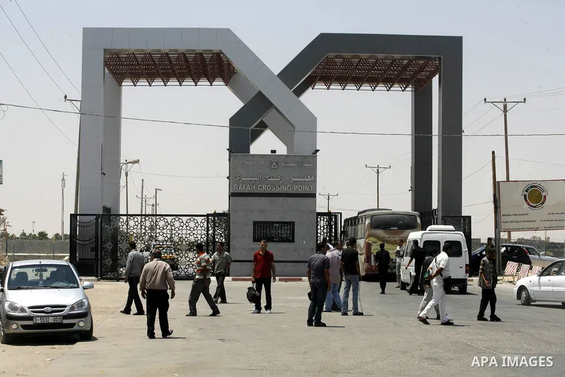 Palestinians wait the buses to cross to Egypt through the Rafah border crossing between the Gaza Strip and Egypt in Gaza city, on 24 July 2012. Egyptian Ambassador of Arab Republic , of the Palestinian Authority, Yasser...