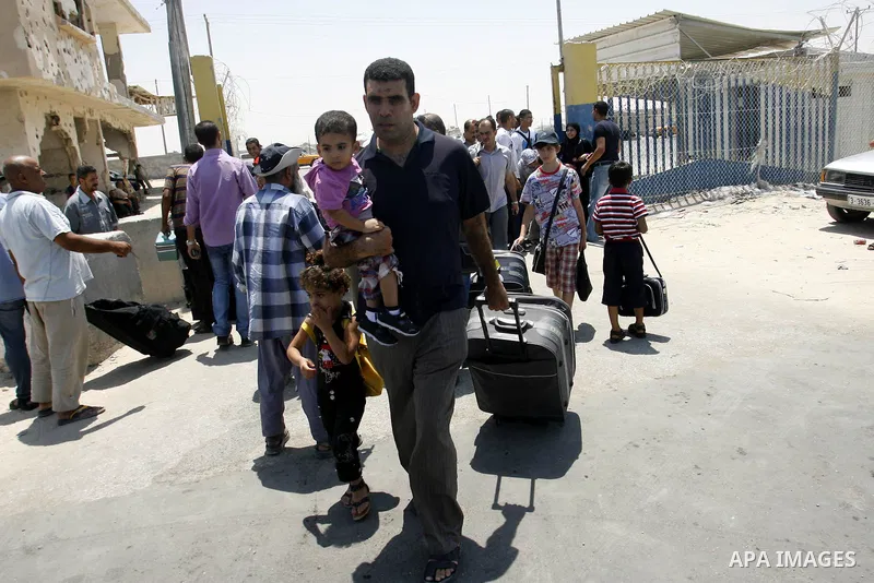 Palestinians wait the buses to cross to Egypt through the Rafah border crossing between the Gaza Strip and Egypt in Gaza city, on 24 July 2012. Egyptian Ambassador of Arab Republic , of the Palestinian Authority, Yasser...