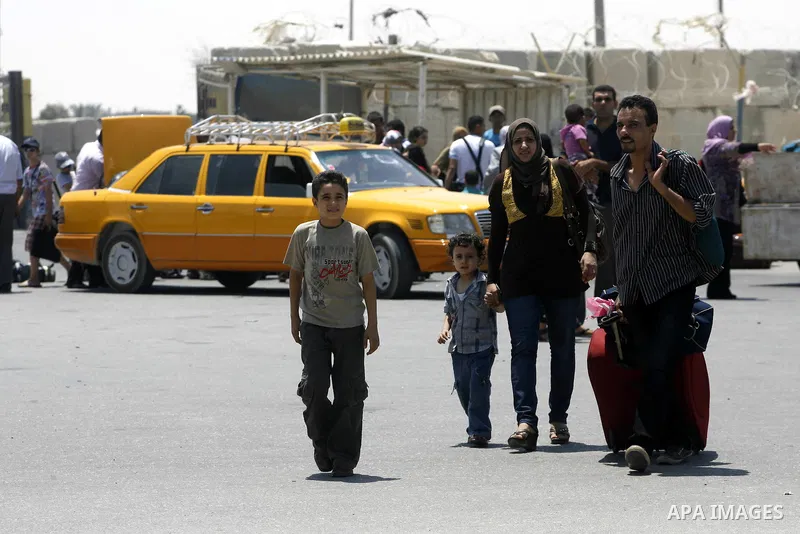 Palestinians wait the buses to cross to Egypt through the Rafah border crossing between the Gaza Strip and Egypt in Gaza city, on 24 July 2012. Egyptian Ambassador of Arab Republic , of the Palestinian Authority, Yasser...