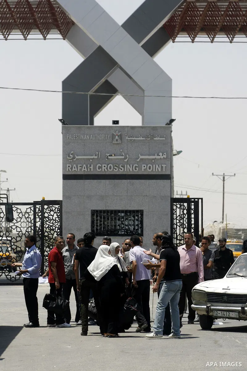 Palestinians wait the buses to cross to Egypt through the Rafah border crossing between the Gaza Strip and Egypt in Gaza city, on 24 July 2012. Egyptian Ambassador of Arab Republic , of the Palestinian Authority, Yasser...