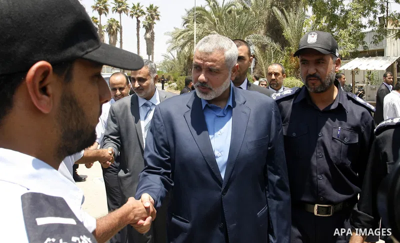 Palestinian Prime Minister in Gaza Strip, Ismail Haniya, leaves Rafah border crossing in the southern Gaza Strip on July 25, 2012. will meet with Egyptian President Mohamed Morsi at the presidential palace, in Cairo, Egy...