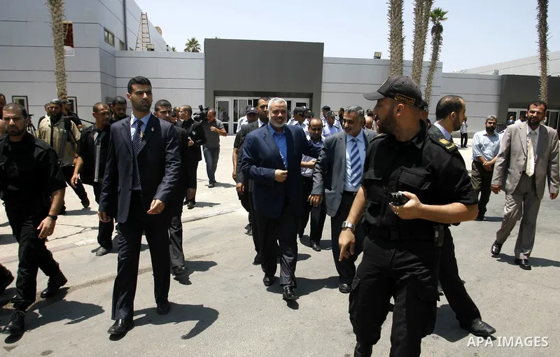 Palestinian Prime Minister in Gaza Strip, Ismail Haniya, leaves Rafah border crossing in the southern Gaza Strip on July 25, 2012. will meet with Egyptian President Mohamed Morsi at the presidential palace, in Cairo, Egy...