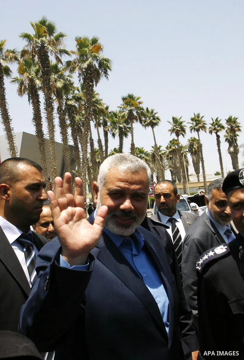 Palestinian Prime Minister in Gaza Strip, Ismail Haniya, leaves Rafah border crossing in the southern Gaza Strip on July 25, 2012. will meet with Egyptian President Mohamed Morsi at the presidential palace, in Cairo, Egy...