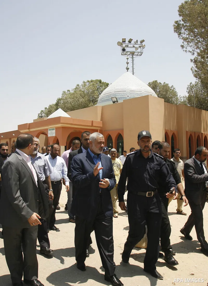 Palestinian Prime Minister in Gaza Strip, Ismail Haniya, leaves Rafah border crossing in the southern Gaza Strip on July 25, 2012. will meet with Egyptian President Mohamed Morsi at the presidential palace, in Cairo, Egy...