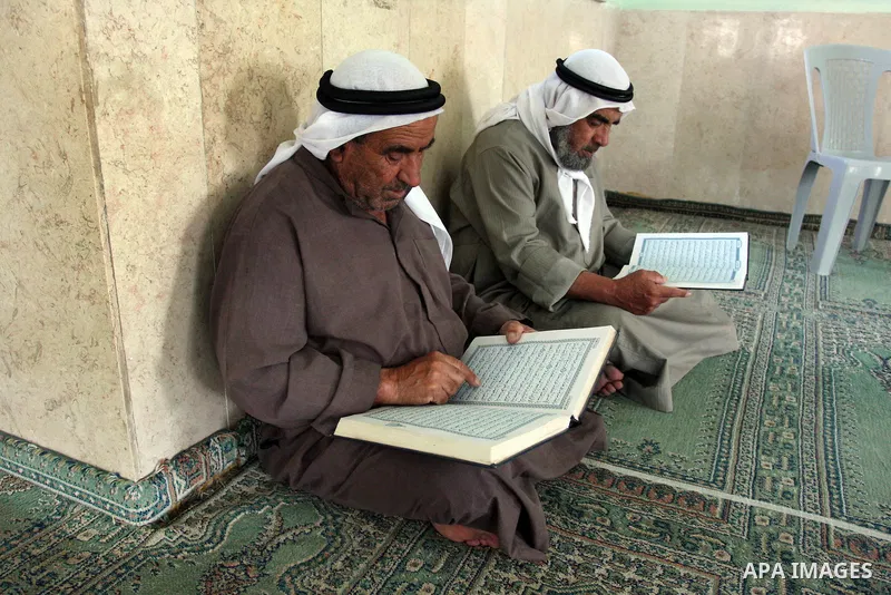 Palestinians read the holy Qur'an at the mosque in West Bank City of Ramallah, on 25 July 2012. Muslims around the world refrain from eating, drinking and sexual intercourse from dawn till dusk during Ramadan, the holies...