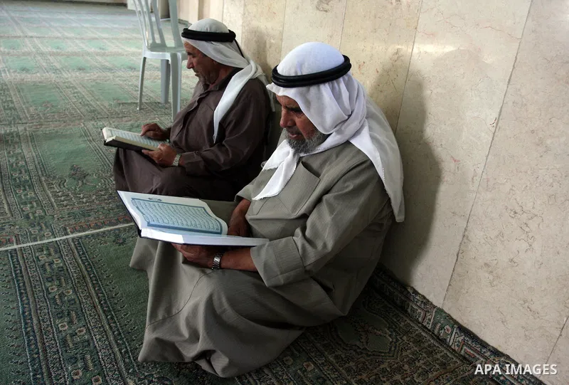 Palestinians read the holy Qur'an at the mosque in West Bank City of Ramallah, on 25 July 2012. Muslims around the world refrain from eating, drinking and sexual intercourse from dawn till dusk during Ramadan, the holies...