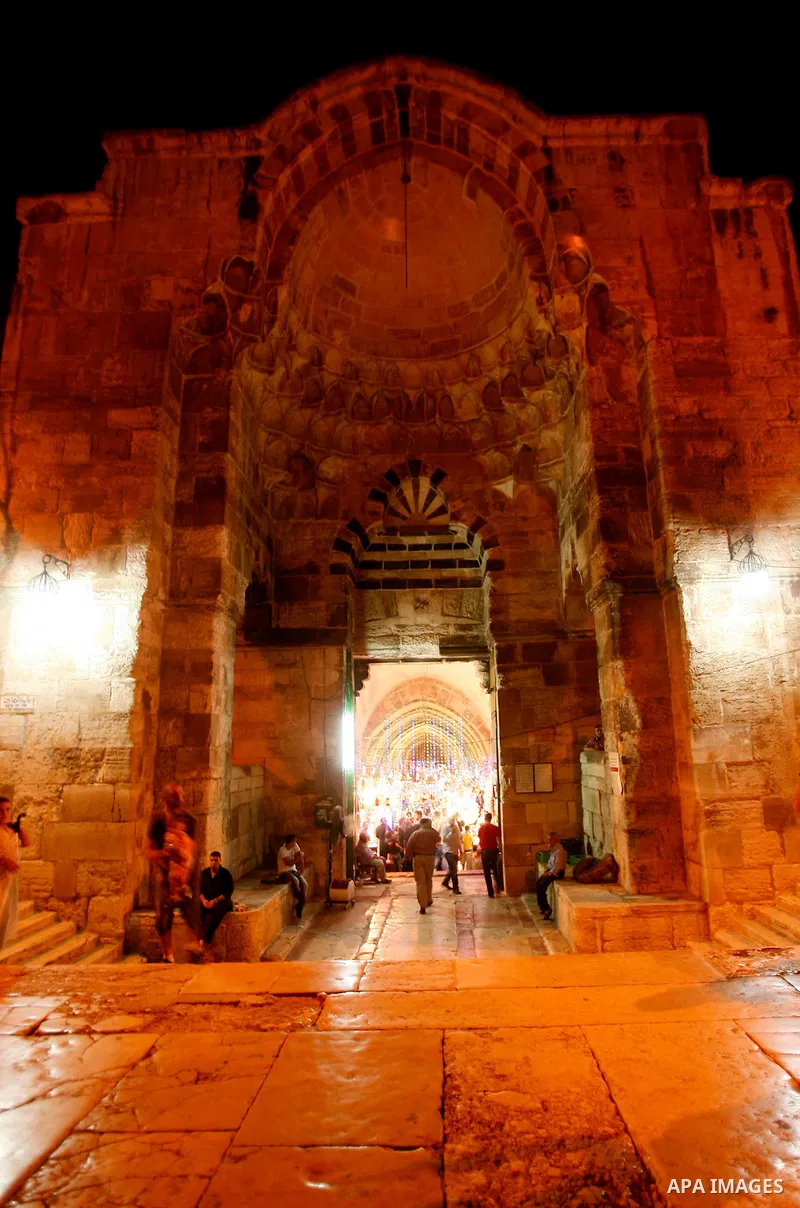 Palestinians walk near al-Aqsa Mosque in Jerusalem's Old City during the holy month of Ramadan, on 25 July 2012. Muslims around the world abstain from eating, drinking and conducting sexual relations from dawn till dusk...