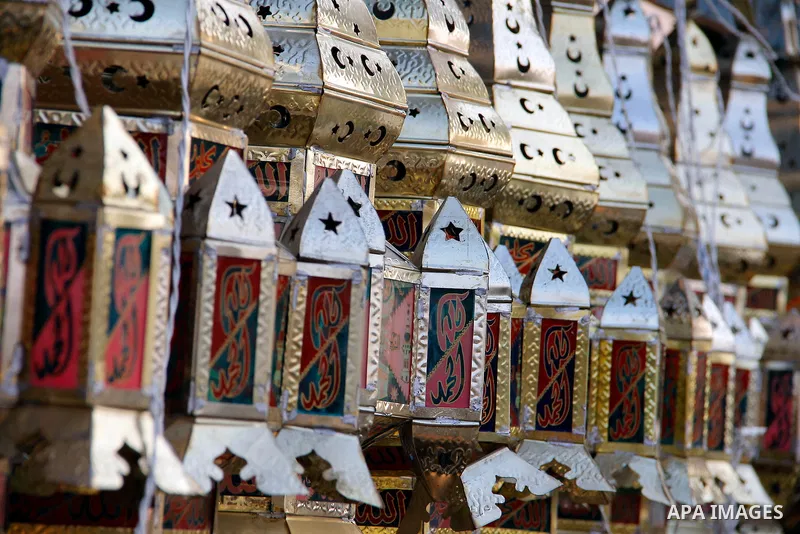 Egyptians hangs Ramadan lanterns (or Fanoos Ramadan) that are displayed for sale at a shop during the Muslim fasting month of Ramadan, in Cairo July 26, 2012. Photo by Amr Mostafa