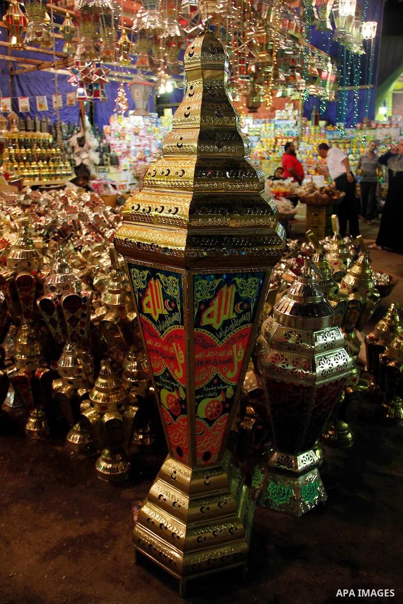 Egyptians hangs Ramadan lanterns (or Fanoos Ramadan) that are displayed for sale at a shop during the Muslim fasting month of Ramadan, in Cairo July 26, 2012. Photo by Amr Mostafa