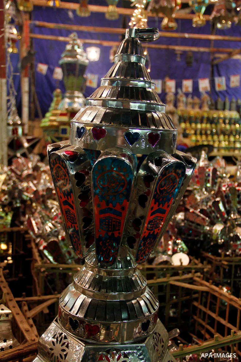 Egyptians hangs Ramadan lanterns (or Fanoos Ramadan) that are displayed for sale at a shop during the Muslim fasting month of Ramadan, in Cairo July 26, 2012. Photo by Amr Mostafa