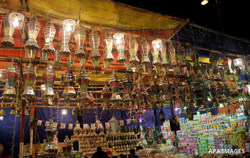Egyptians hangs Ramadan lanterns (or Fanoos Ramadan) that are displayed for sale at a shop during the Muslim fasting month of Ramadan, in Cairo July 26, 2012. Photo by Amr Mostafa