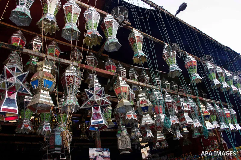 Egyptians hangs Ramadan lanterns (or Fanoos Ramadan) that are displayed for sale at a shop during the Muslim fasting month of Ramadan, in Cairo July 26, 2012. Photo by Amr Mostafa