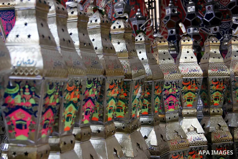 Egyptians hangs Ramadan lanterns (or Fanoos Ramadan) that are displayed for sale at a shop during the Muslim fasting month of Ramadan, in Cairo July 26, 2012. Photo by Amr Mostafa