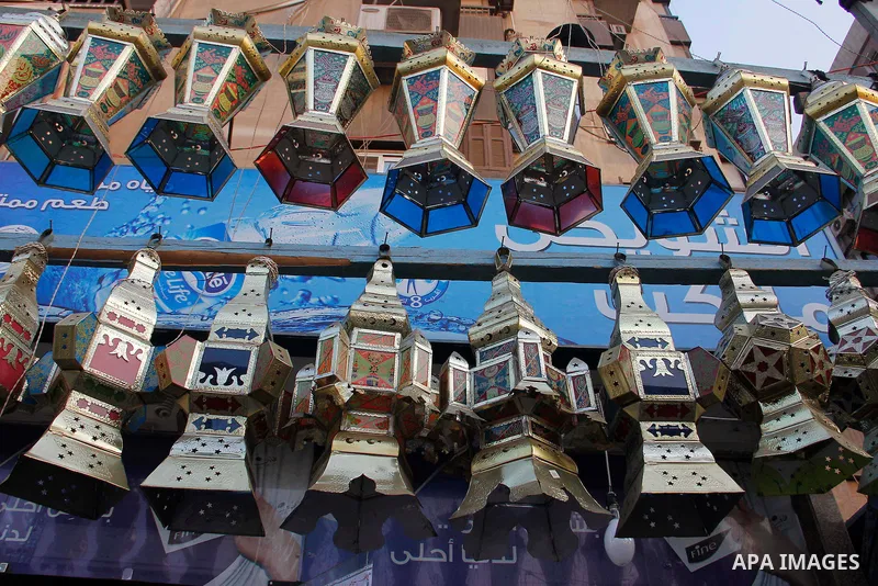 Egyptians hangs Ramadan lanterns (or Fanoos Ramadan) that are displayed for sale at a shop during the Muslim fasting month of Ramadan, in Cairo July 26, 2012. Photo by Amr Mostafa