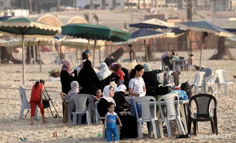 Palestinians getting ready for break their fast at Gaza beach during the fasting holy month of Ramadan, in Gaza city on 26 July 2012. Muslims throughout the world are celebrating the fasting month of Ramadan, the holiest...
