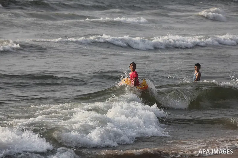 Palestinian children enjoy swimming at Gaza beach during the fasting holy month of Ramadan, in Gaza city on 26 July 2012. Photo by Majdi Fathi