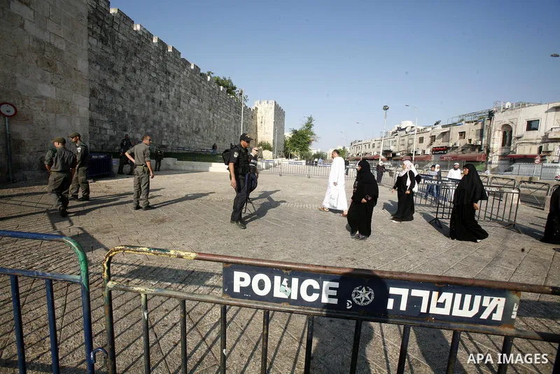 Palestinian worshippers pray outside al-Aqsa mosque in Jerusalem's Old City on the Second Friday of the holy month of Ramadan July 27, 2012. Israeli police said that Palestinian over the age of 40 would be freely permitt...