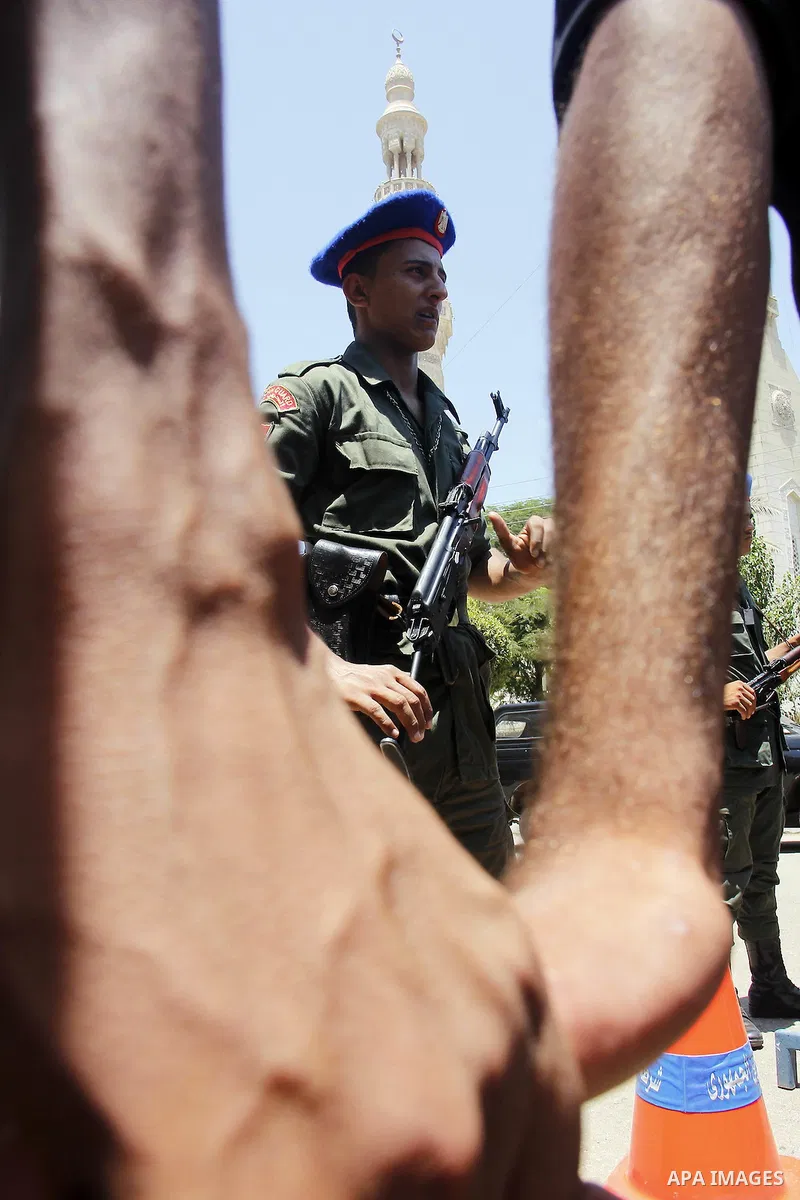Egyptian policemen stand guard outside a mosque where Mursi will be taking part in Friday prayers during the Islamic holy month of Ramadan in Fayoum, about 100 km (60 miles) southeast of Cairo, July 27, 2012. Photo by Am...