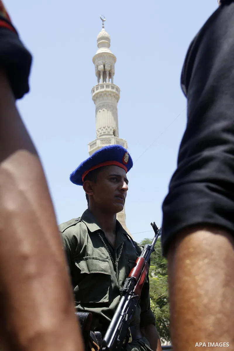 Egyptian policemen stand guard outside a mosque where Mursi will be taking part in Friday prayers during the Islamic holy month of Ramadan in Fayoum, about 100 km (60 miles) southeast of Cairo, July 27, 2012. Photo by Am...