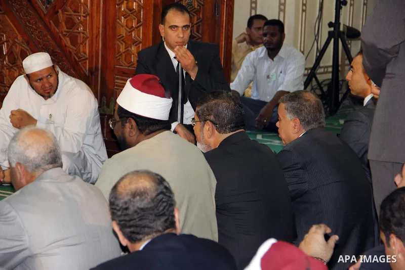 Egyptian President Mohamed Morsi performing Friday noon prayers at a mosque in the district of Fayoum, south west of Cairo, during the Muslim holy fasting month of Ramadan, on July 27, 2012. Photo by Amr Mostafa