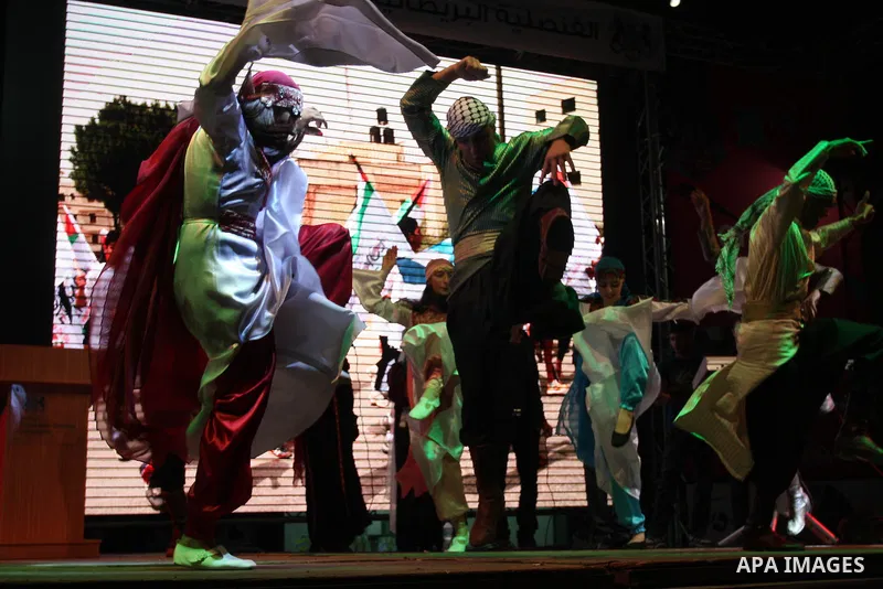 Palestinians celebrate of the opening Olympics Games in London, on July 27, 2012, in the West Bank city of Ramallah. Photo by Issam Rimawi