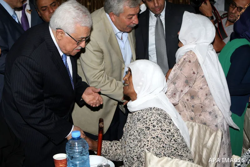 Palestinian President Mahmoud Abbas (Abu Mazen) breaks with the elderly and blind in the West Bank city of Jenin on July 28, 2012. Photo by Thaer Ganaim