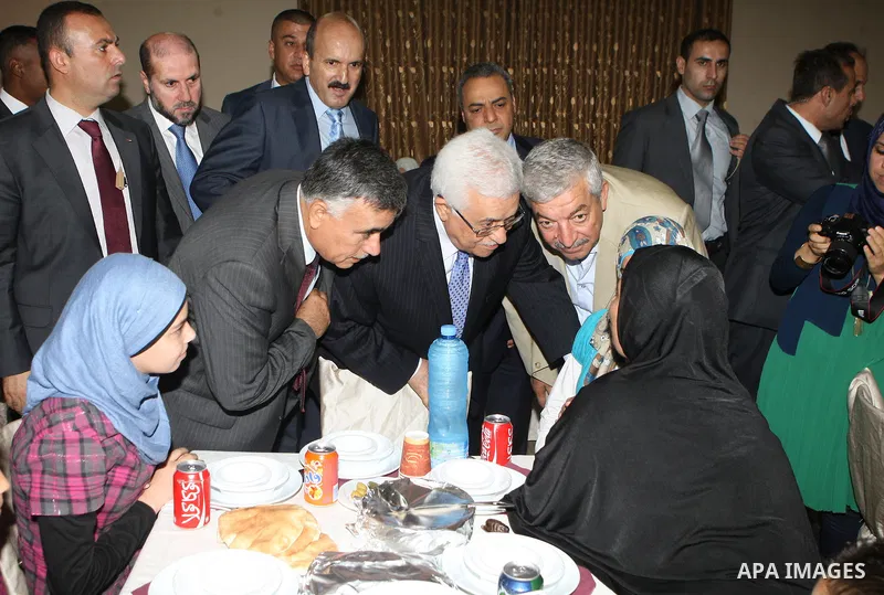 Palestinian President Mahmoud Abbas (Abu Mazen) breaks with the elderly and blind in the West Bank city of Jenin on July 28, 2012. Photo by Thaer Ganaim