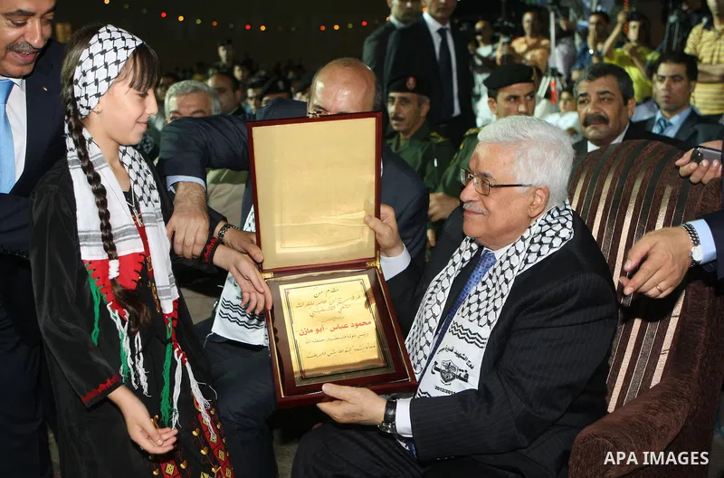 Palestinian President Mahmoud Abbas (Abu Mazen) participates in a graduation ceremony for outstanding students in the West Bank city of Jenin on July 28, 2012. Photo by Thaer Ganaim