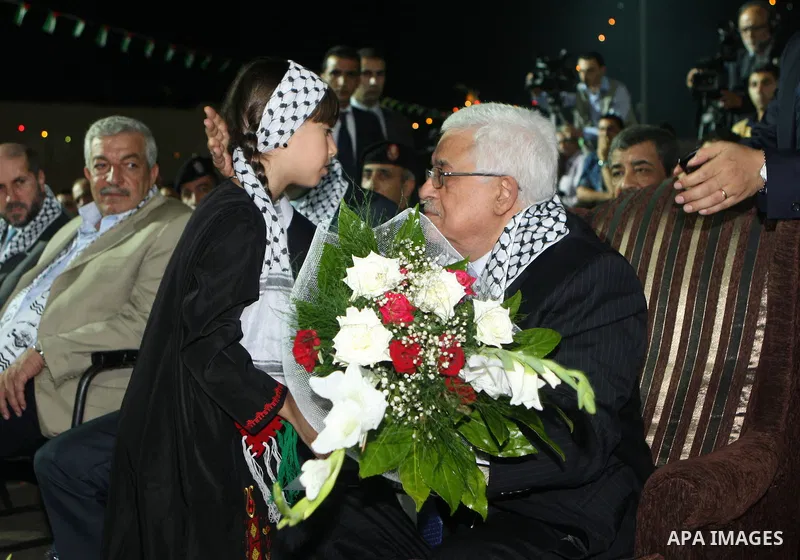 Palestinian President Mahmoud Abbas (Abu Mazen) participates in a graduation ceremony for outstanding students in the West Bank city of Jenin on July 28, 2012. Photo by Thaer Ganaim