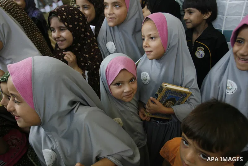 Palestinian girls read the holy Qur'an at mosque in Rafah in southern Gaza strip, on 29 July 2012. Muslims around the world refrain from eating, drinking and sexual intercourse from dawn till dusk during Ramadan, the hol...