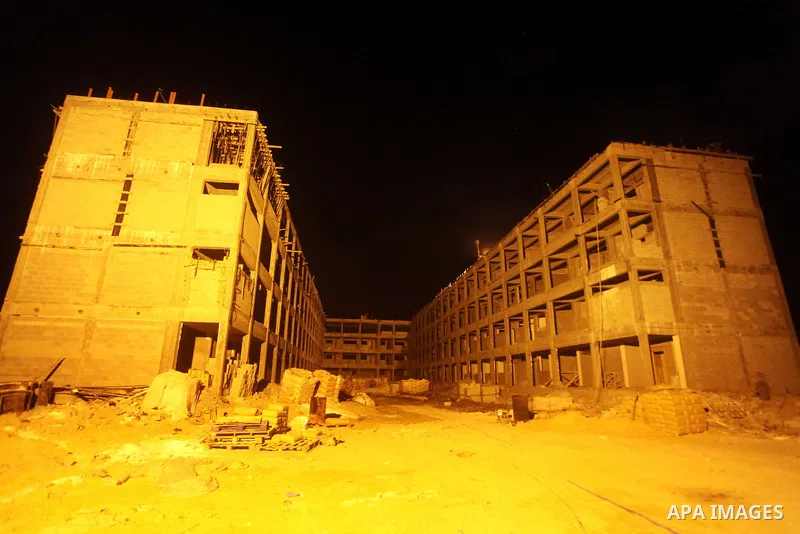 Palestinian construction workers work at night in Deir al-Balah in central Gaza Strip on 29 July 2012. Palestinian construction workers work during the night in the month of Ramadan because of the high temperatures they...