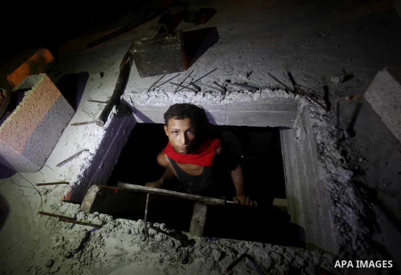 Palestinian construction workers work at night in Deir al-Balah in central Gaza Strip on 29 July 2012. Palestinian construction workers work during the night in the month of Ramadan because of the high temperatures they...