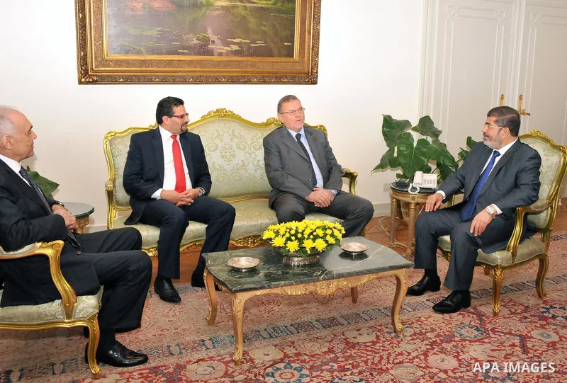 Egyptian President Mohamed Morsi (R) meets with Libyan Foreign Affairs Minister Ashur bin Khayal (C) and Tunisian Foreign Minister Rafik Abdessalem (L), at the presidential palace, in Cairo, Egypt, 29 July 2012. Photo by...