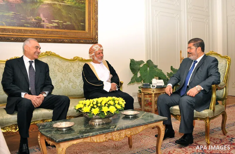 Egyptian President Mohamed Morsi (R) meets with Foreign Minister of Oman Yusuf bin Alawi (2-R)) with the presence of Egyptian Foreign Minister Mohammed Kamel Amr (L) at the presidential palace, in Cairo, Egypt, 29 July 2...