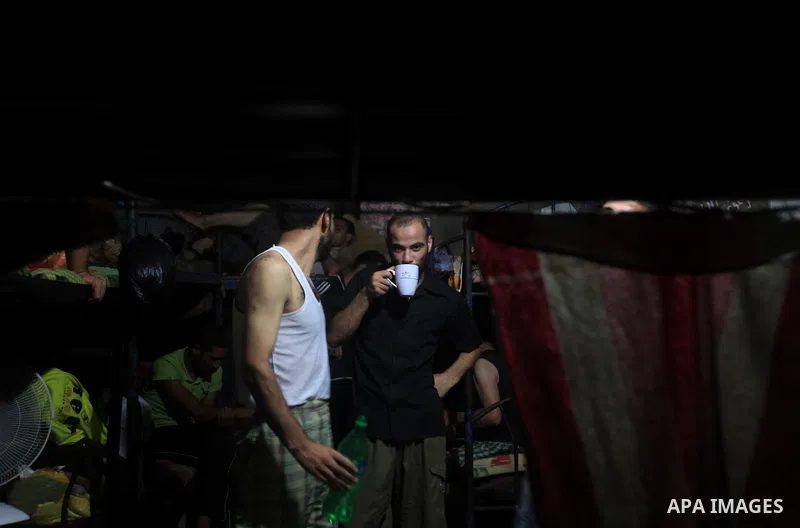 Palestinian inmates inside their cell during the holy month of Ramadan at prison controlled by the Hamas police in Gaza city on 29 July 2012. Hamas police released more than 150 criminal inmates before the fasting month...