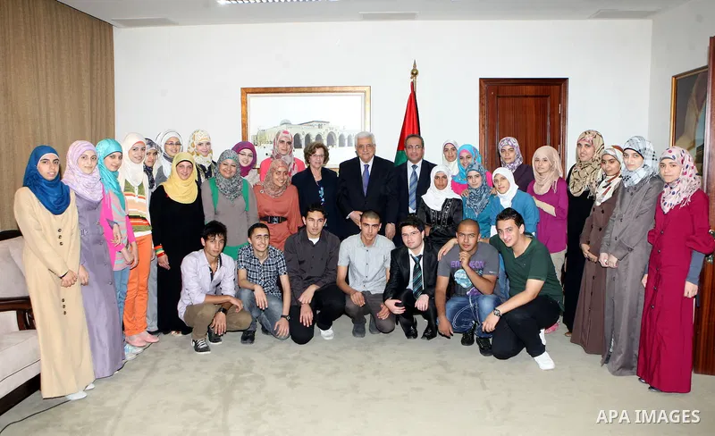 Palestinian President Mahmoud Abbas (Abu Mazen) meets with the excellent students in the high school certificate, in the West Bank city of Ramallah, on July 30, 2012. Photo by Thaer Ganaim