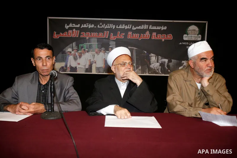 Sheikh Raed Salah (R), Sheikh Ikrima Sabri (C) and lawyer Khaled Zabarqa during a press conference to reveal the last of Israeli assaults on al-Aqsa Mosque and the hill of Bab al-maghareba, in Jerusalem city on 31 July 2...