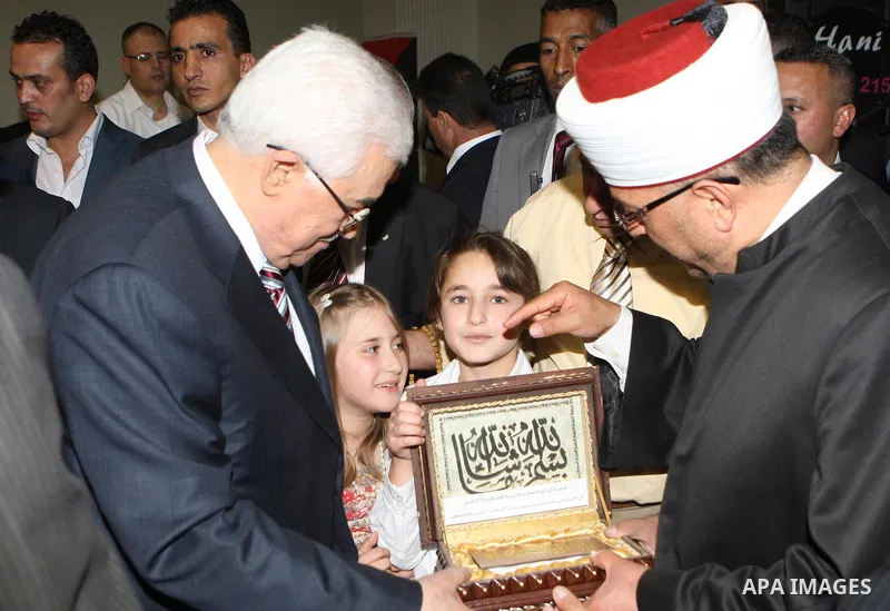 Palestinian President, Mahmoud Abbas (Abu Mazen), participates in breakfast with the group of Palestinian orphans in the West Bank city of Hebron on, Aug. 01, 2012. Photo by Thaer Ganaim