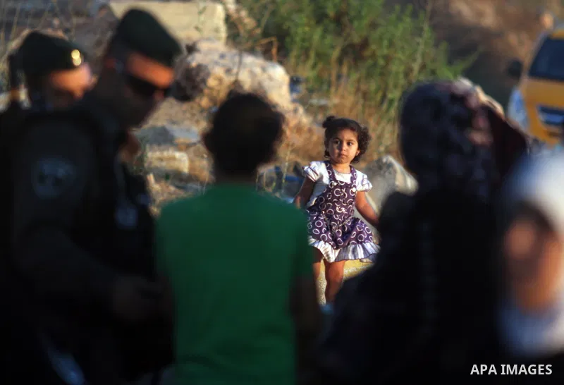 Palestinians wait to cross to Jerusalem from the Qalandia checkpoint near the West Bank city of Ramallah on Aug. 3, 2012. Palestinian Muslims are heading to Jerusalem to attend the third Friday prayers of the fasting mon...