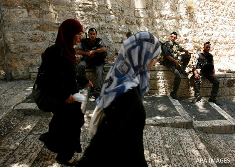 Palestinian Muslims walk outside the Dome of the Rock at the Al-Aqsa mosque compound in Jerusalem during the third Friday prayers of Islam's holy month of Ramadan on August 3, 2012. Muslims fasting in the month of Ramada...