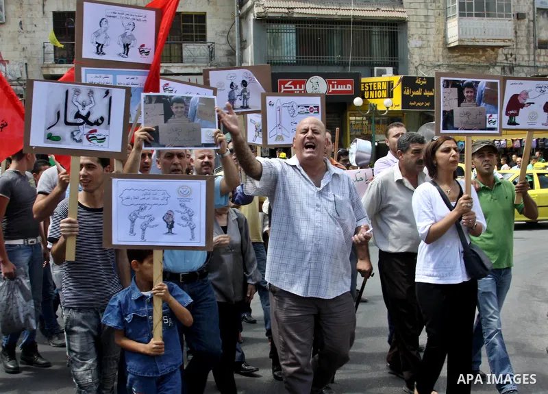 Palestinian demonstrators participate protest against rising prices and taxes in the West Bank, city of Nablus Aug. 04, 2012. Photo by Nedal Eshtayah