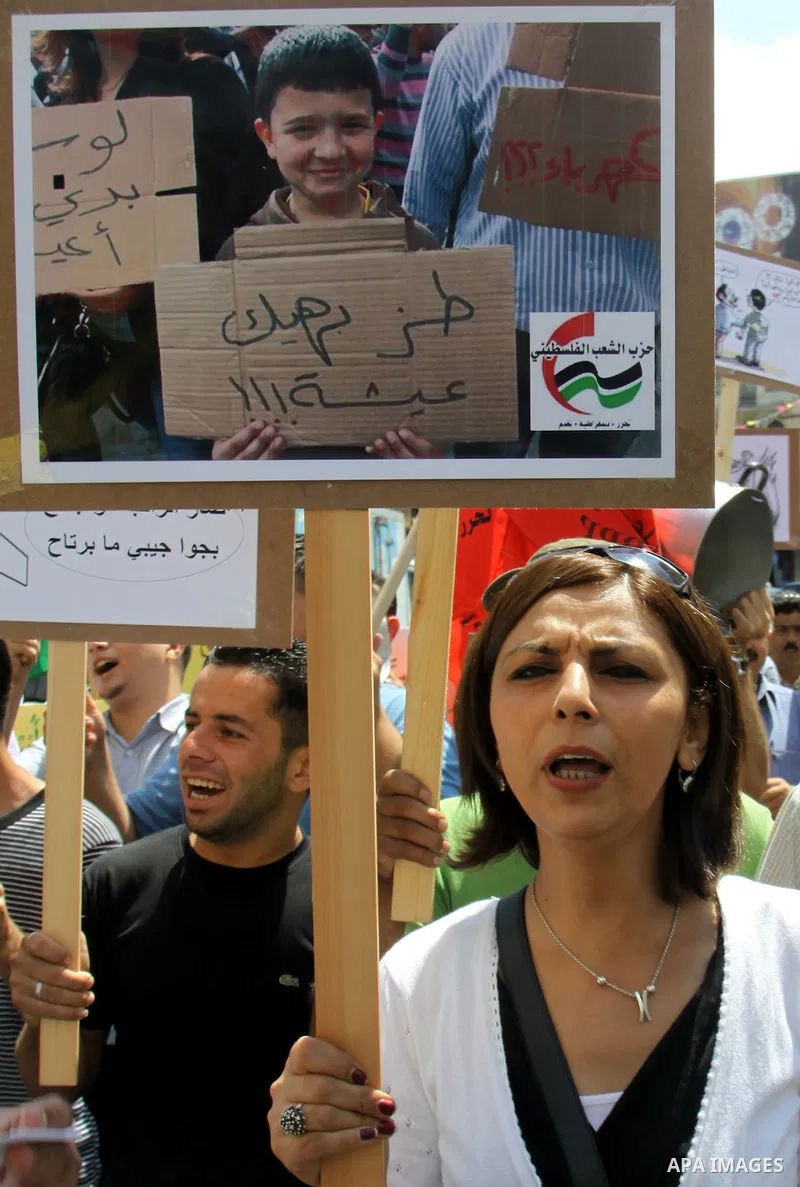 Palestinian demonstrators participate protest against rising prices and taxes in the West Bank, city of Nablus Aug. 04, 2012. Photo by Nedal Eshtayah