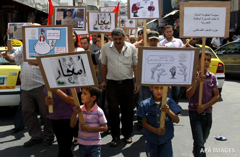 Palestinian demonstrators participate protest against rising prices and taxes in the West Bank, city of Nablus Aug. 04, 2012. Photo by Nedal Eshtayah