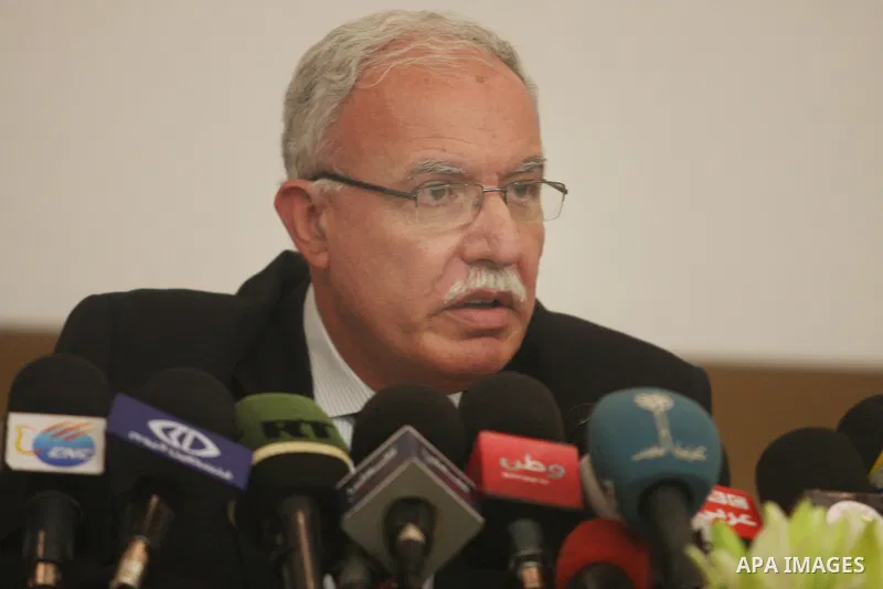 Palestinian foreign minister Riad al-Malki speaks to the press in the West Bank city of Ramallah on August 5, 2012, as Non-Aligned Movement (NAM) ministers gather in the neighboring Jordanian capital Amman to take part i...