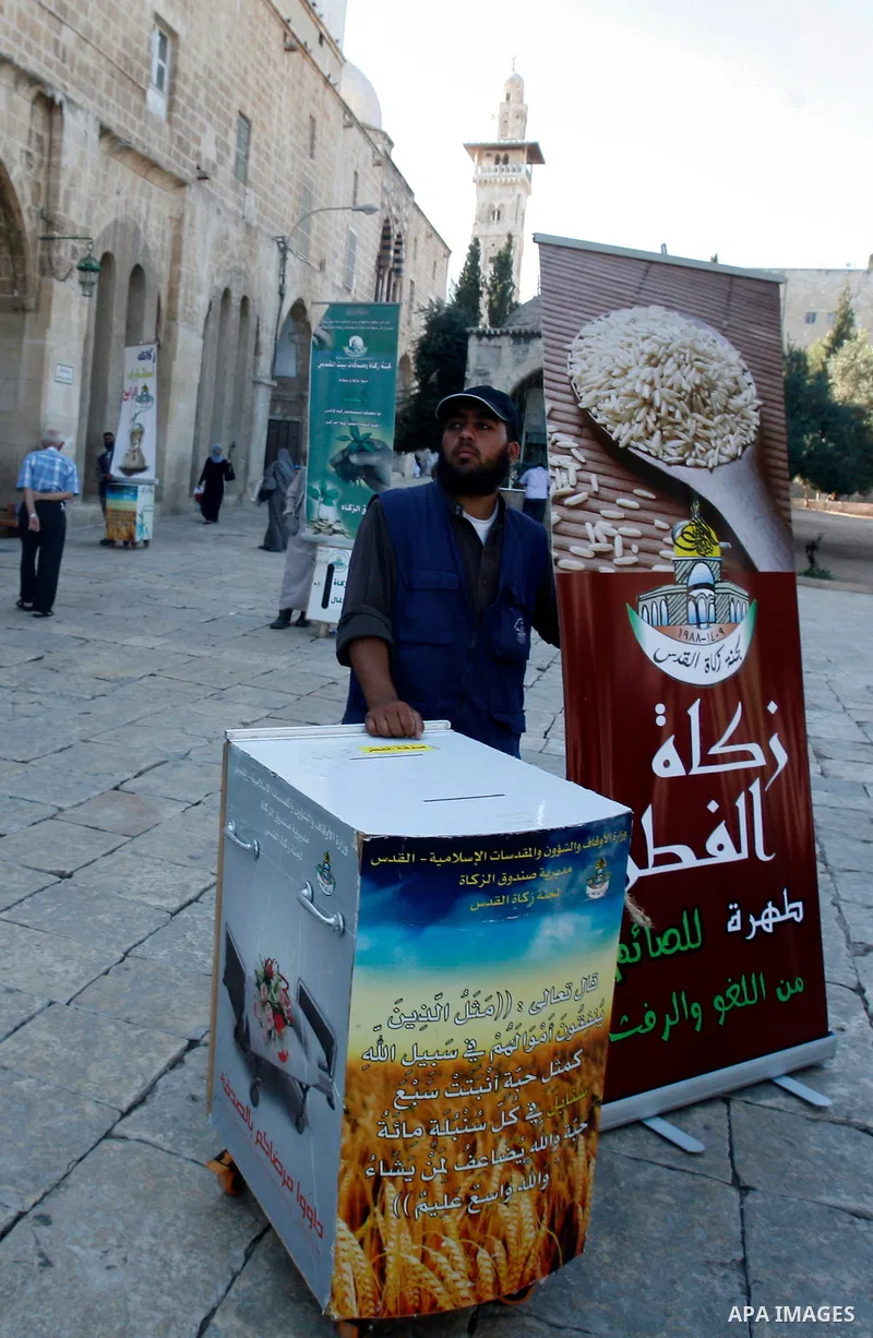 A Palestinian man calls Muslims for donate their alms known as "Zakat" during Ramadan in front of al-Aqsa Mosque in Jerusalem's old city on 05 August 2012. Muslims around the world abstain from eating, drinking and condu...